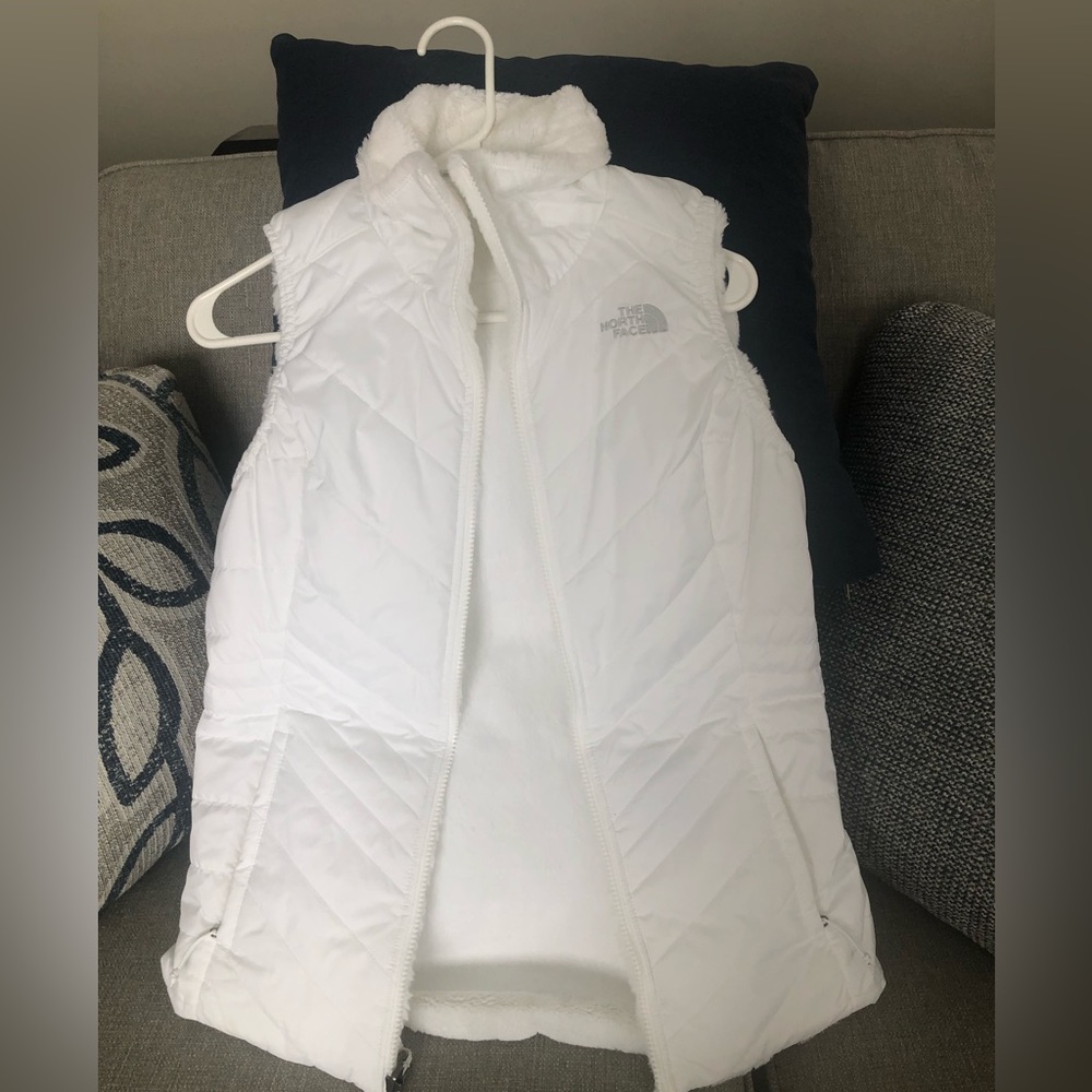 Women’s northface reversible vest. Puffy on one side, fleece on the other side.